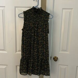 Dress. Sleeveless size medium, black with floral print